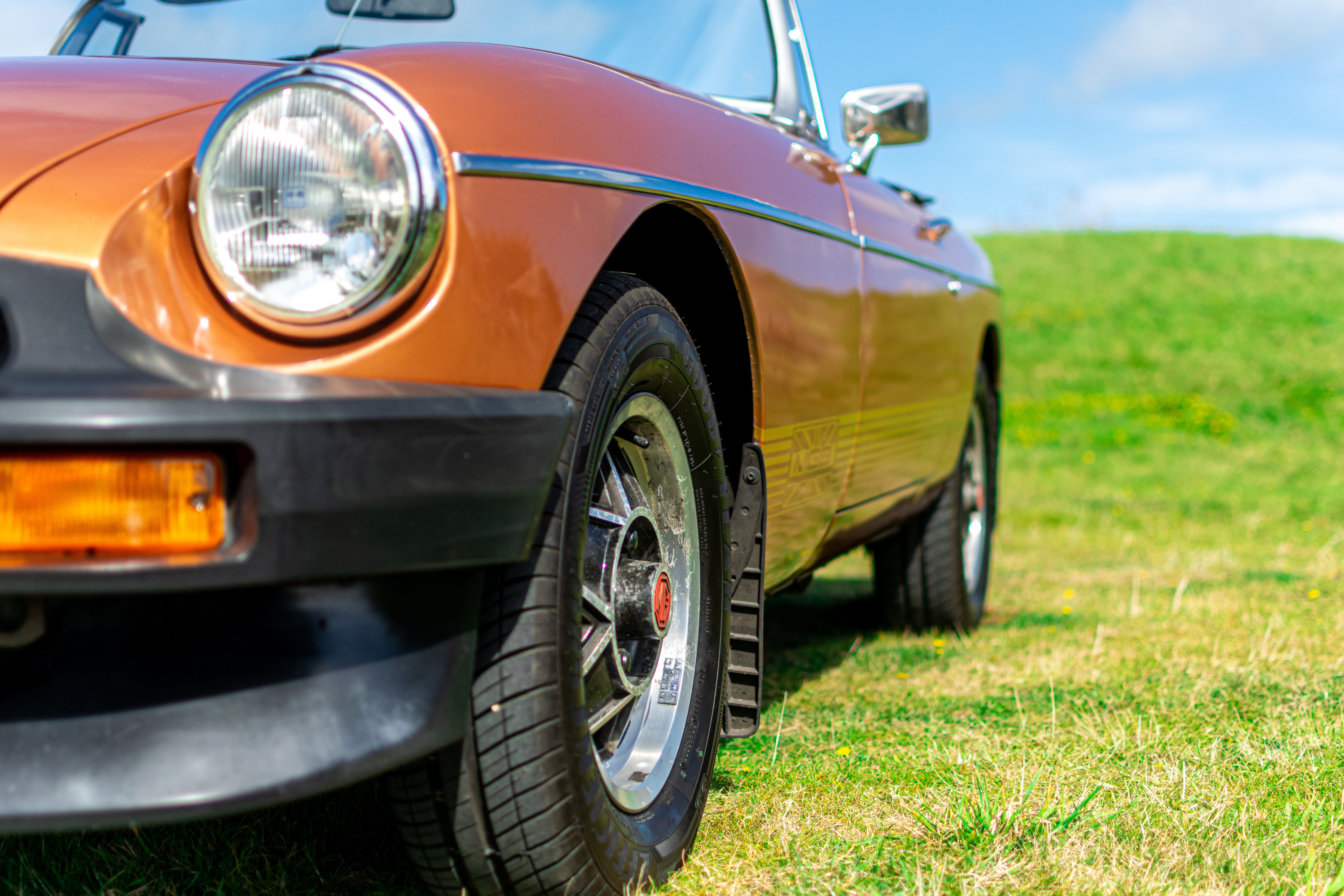 orange mg collectors car on grass