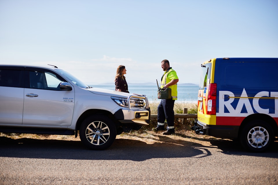 Roadside patrol assisting woman with broken down car