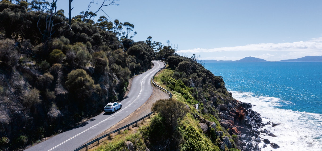 Driving through one of the most picturesque roads in Tasmania. car driving up winding road