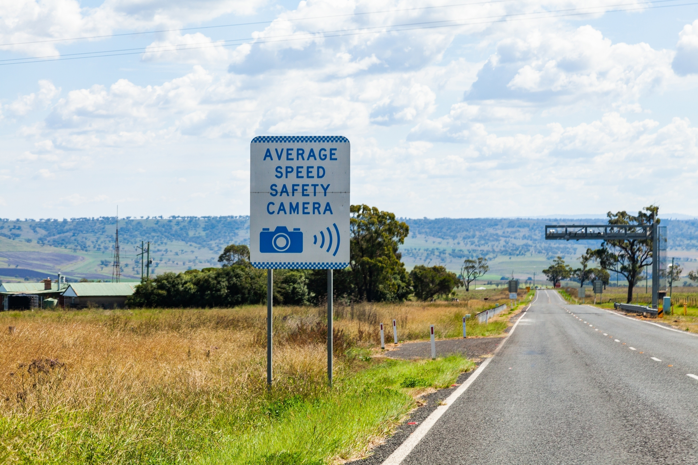 highway with speed camera sign