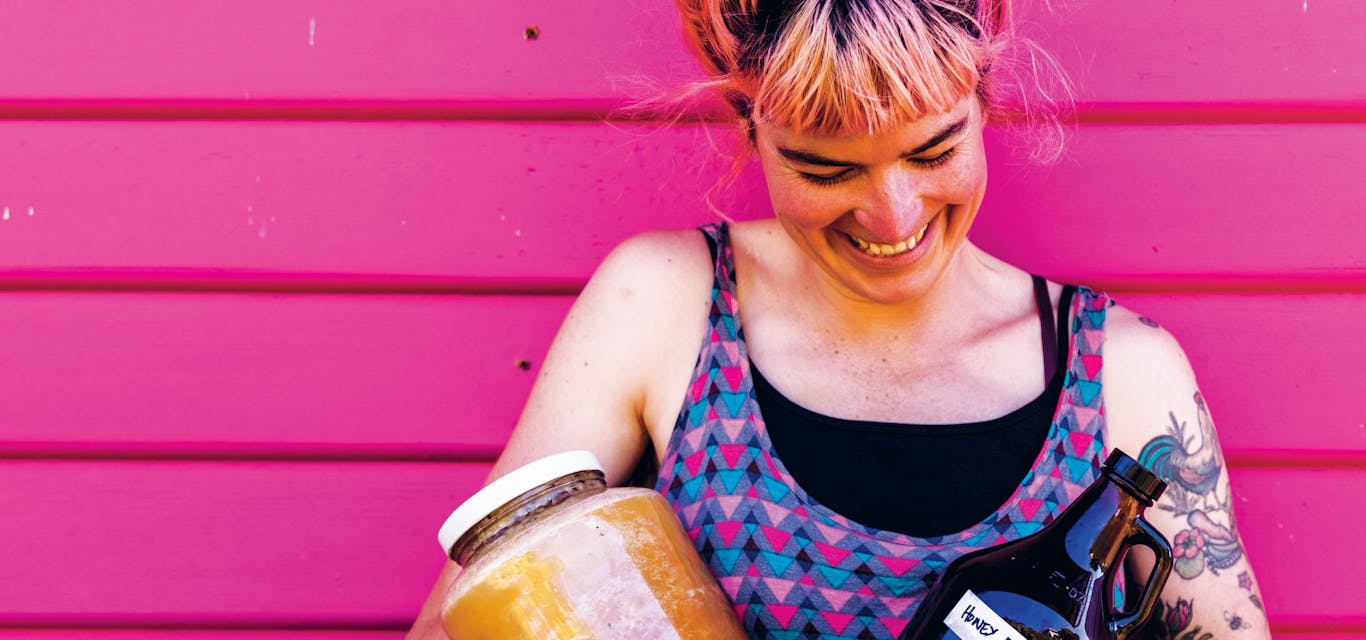 Hannah tries to grow or make the majority of what she consumes. woman with jars