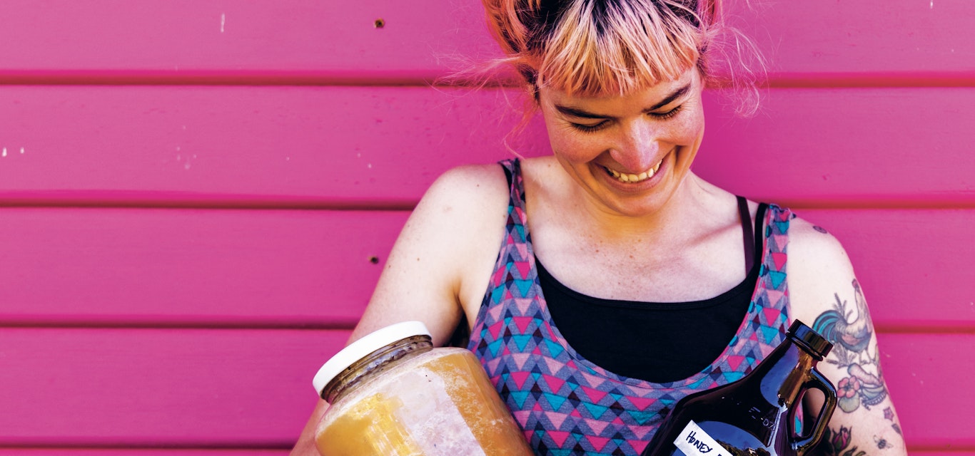Hannah tries to grow or make the majority of what she consumes. woman with jars