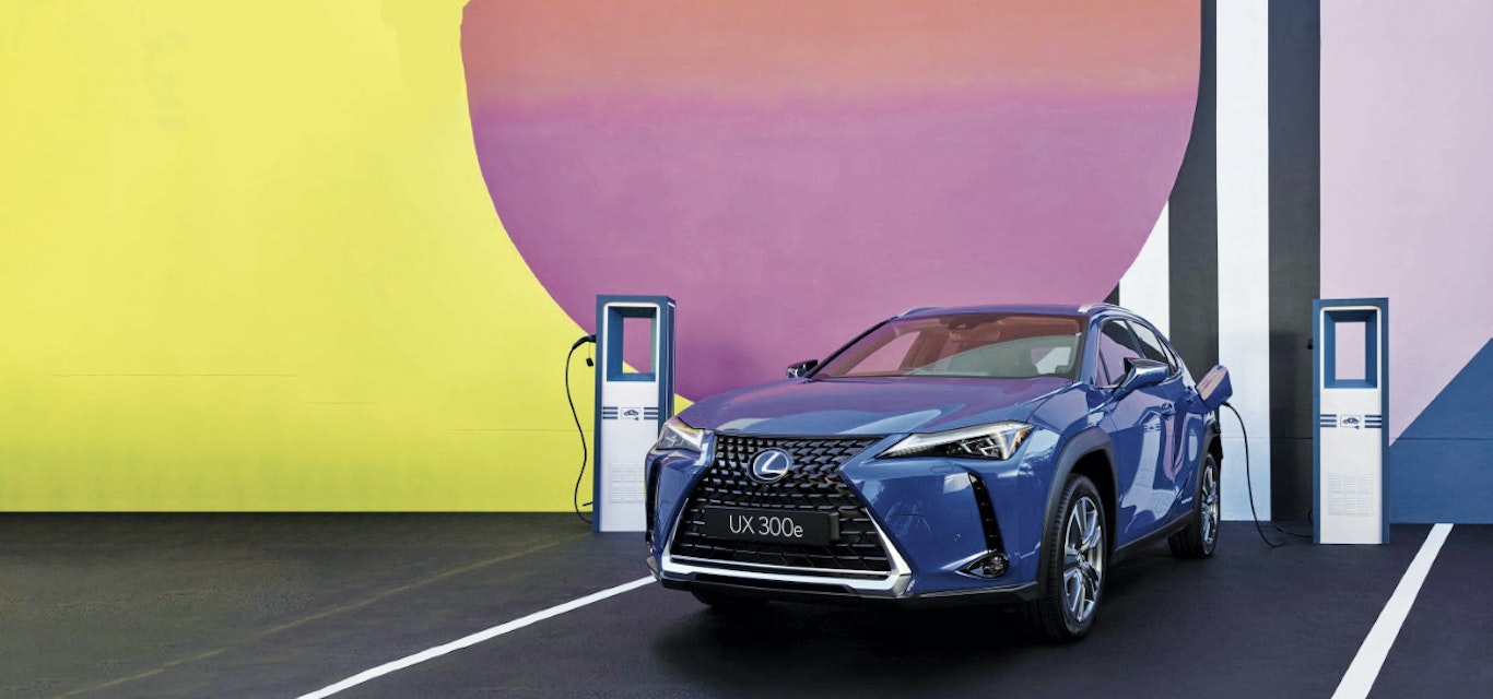 lexus car in front of colourful wall