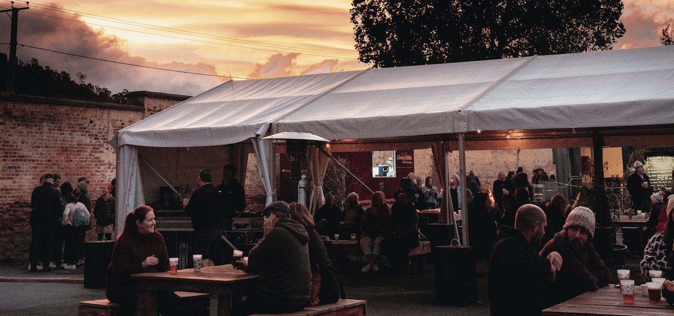 sunset over marquee and tables outside