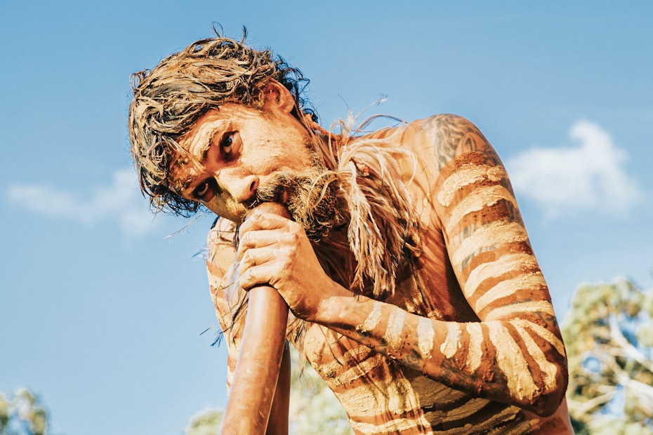 man playing didgeridoo