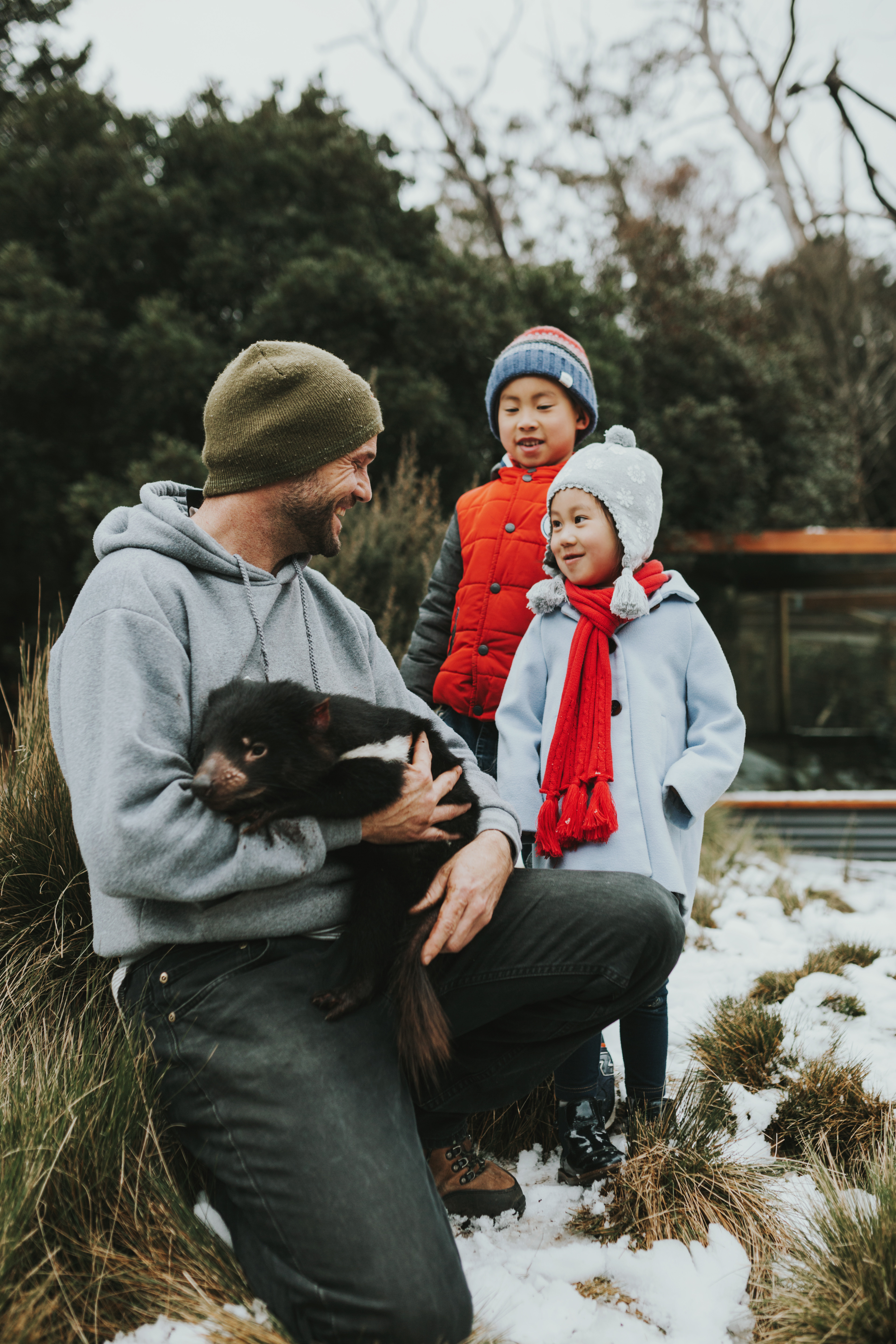 family holding tassie devil