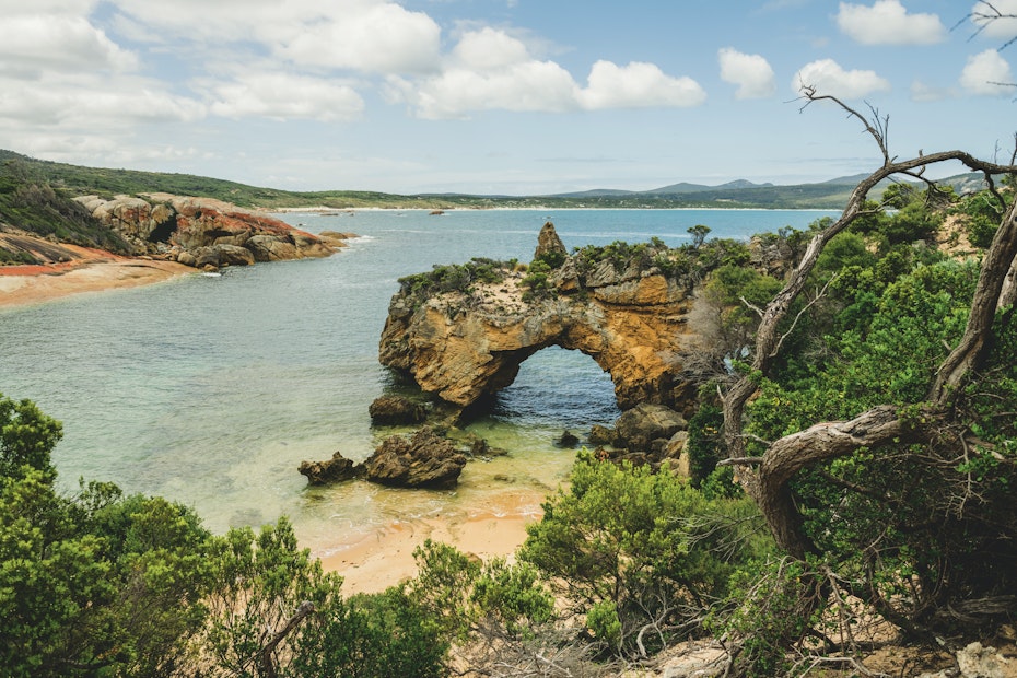 hole in rock over water at beach