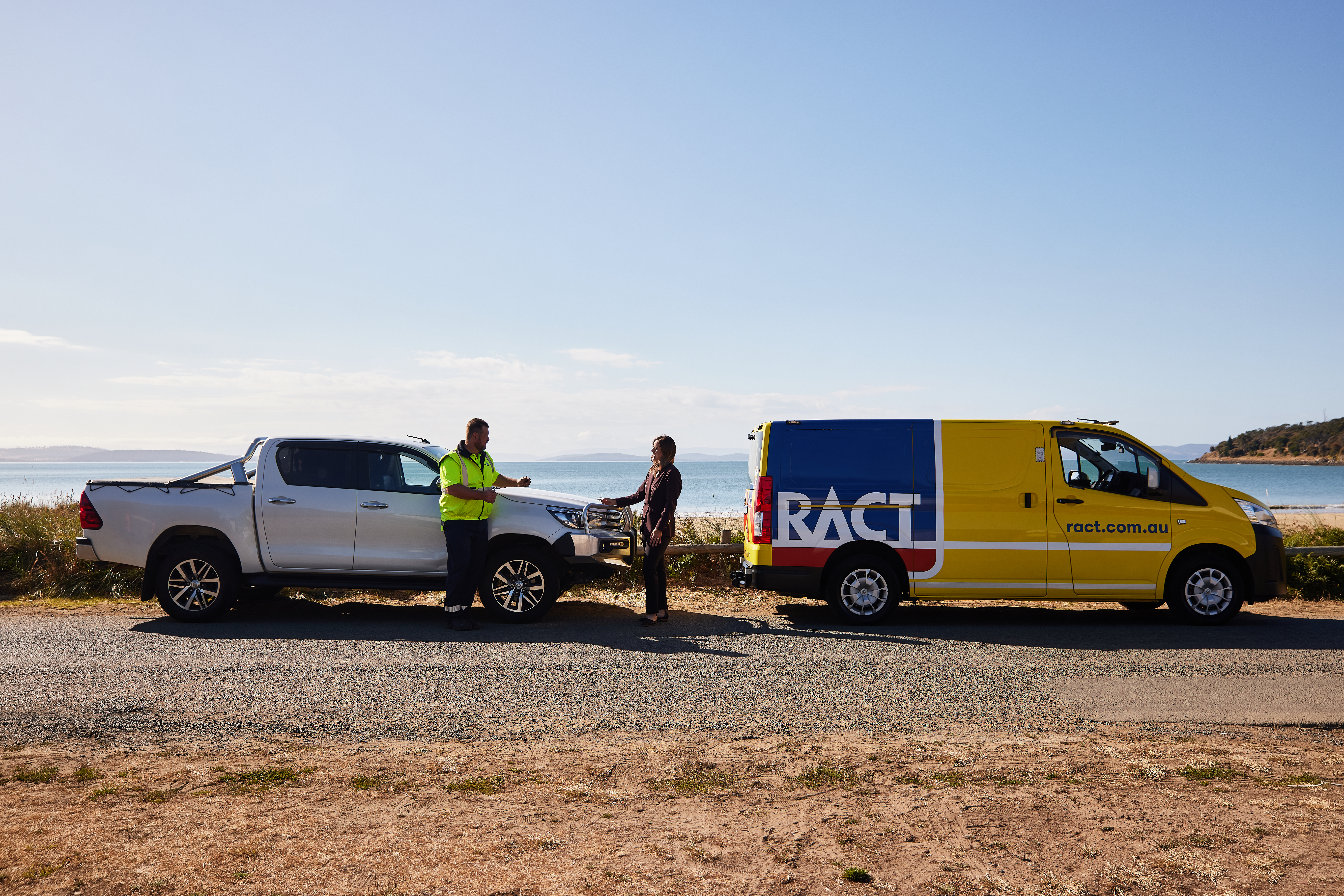 Patrol helping member on side of road near the beach.