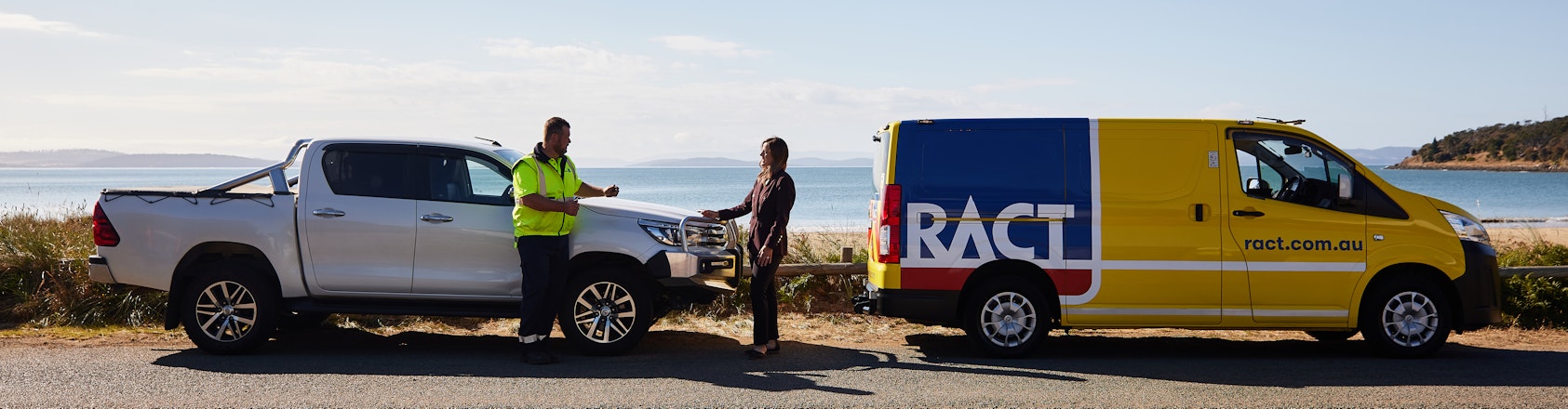 Patrol helping member on side of road near the beach.