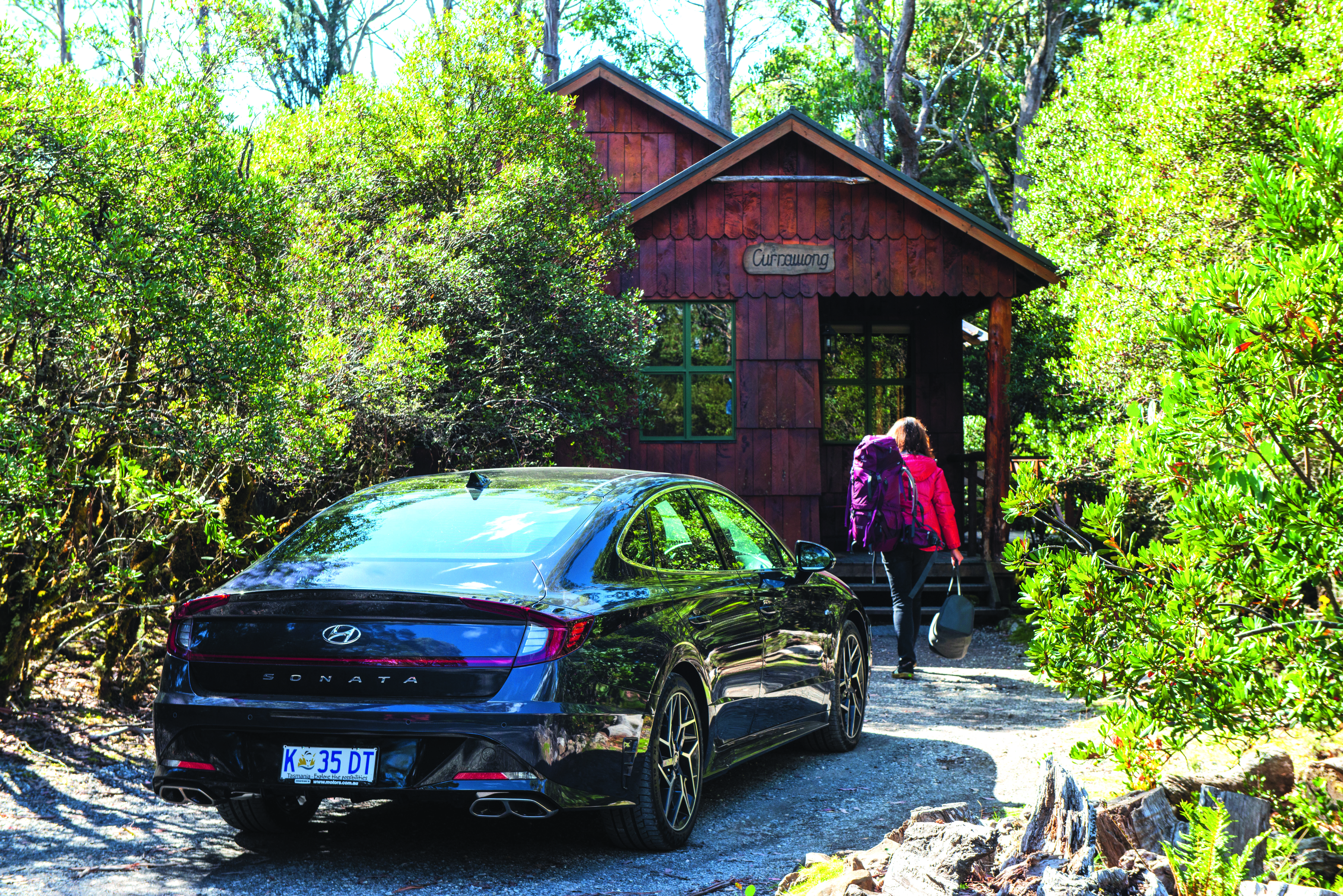 car parked walking into cabin