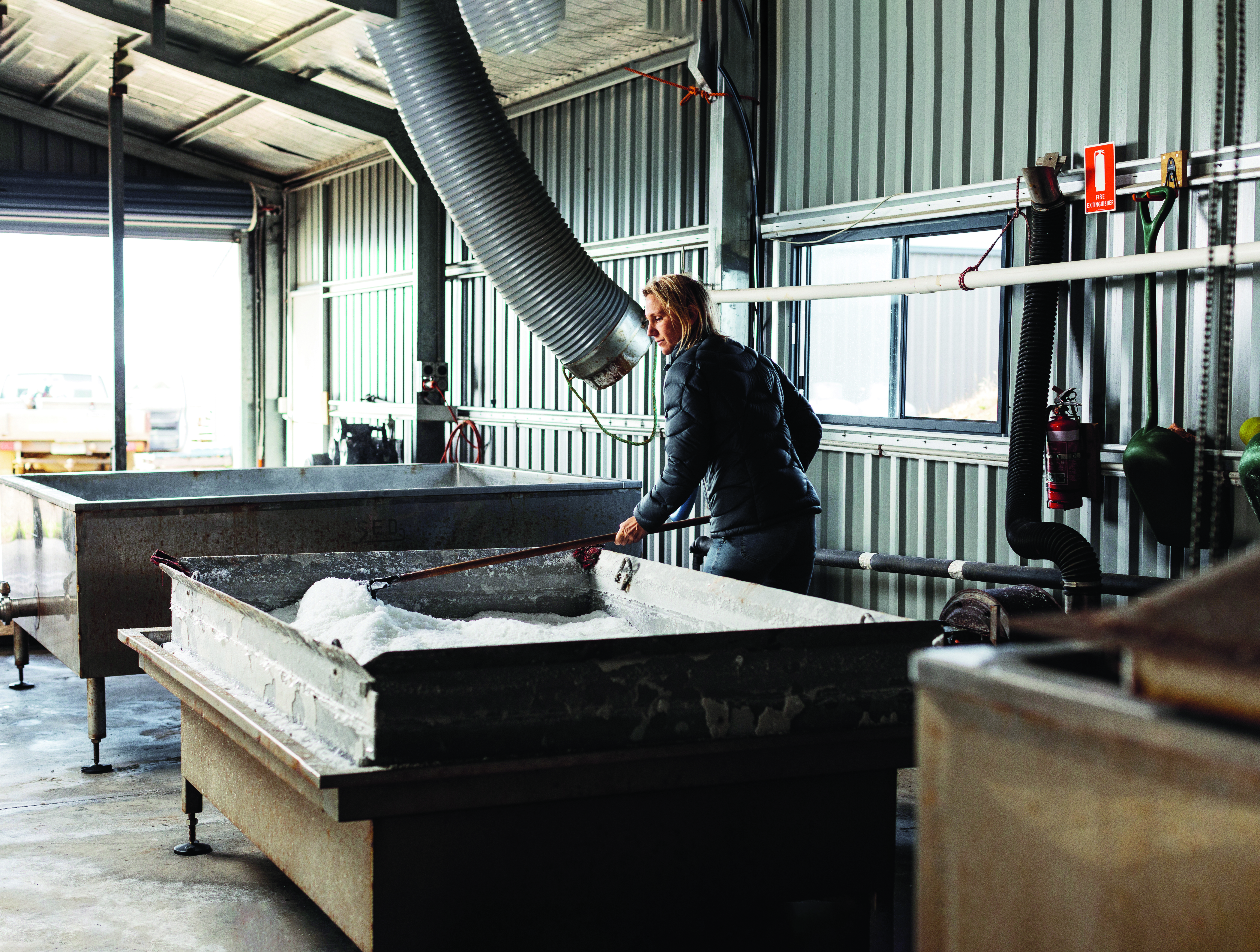 shovelling salt in shed