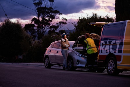 RACT Patrolman checking under the hood of a member's car