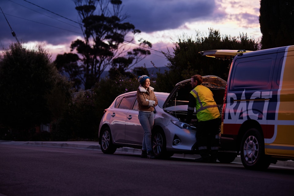 RACT Patrolman checking under the hood of a member's car