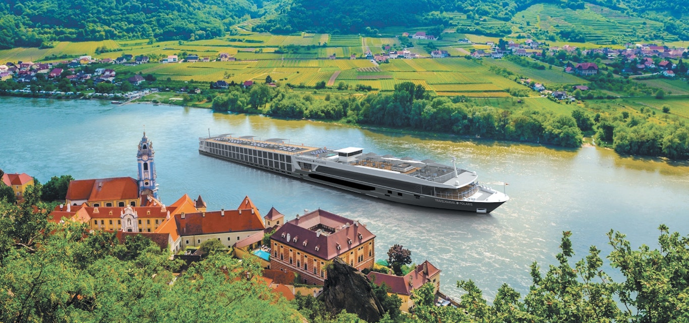 Cruise ship sailing down a river in europe