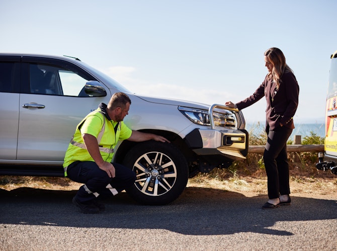 Patrol checking tyres on side of the road