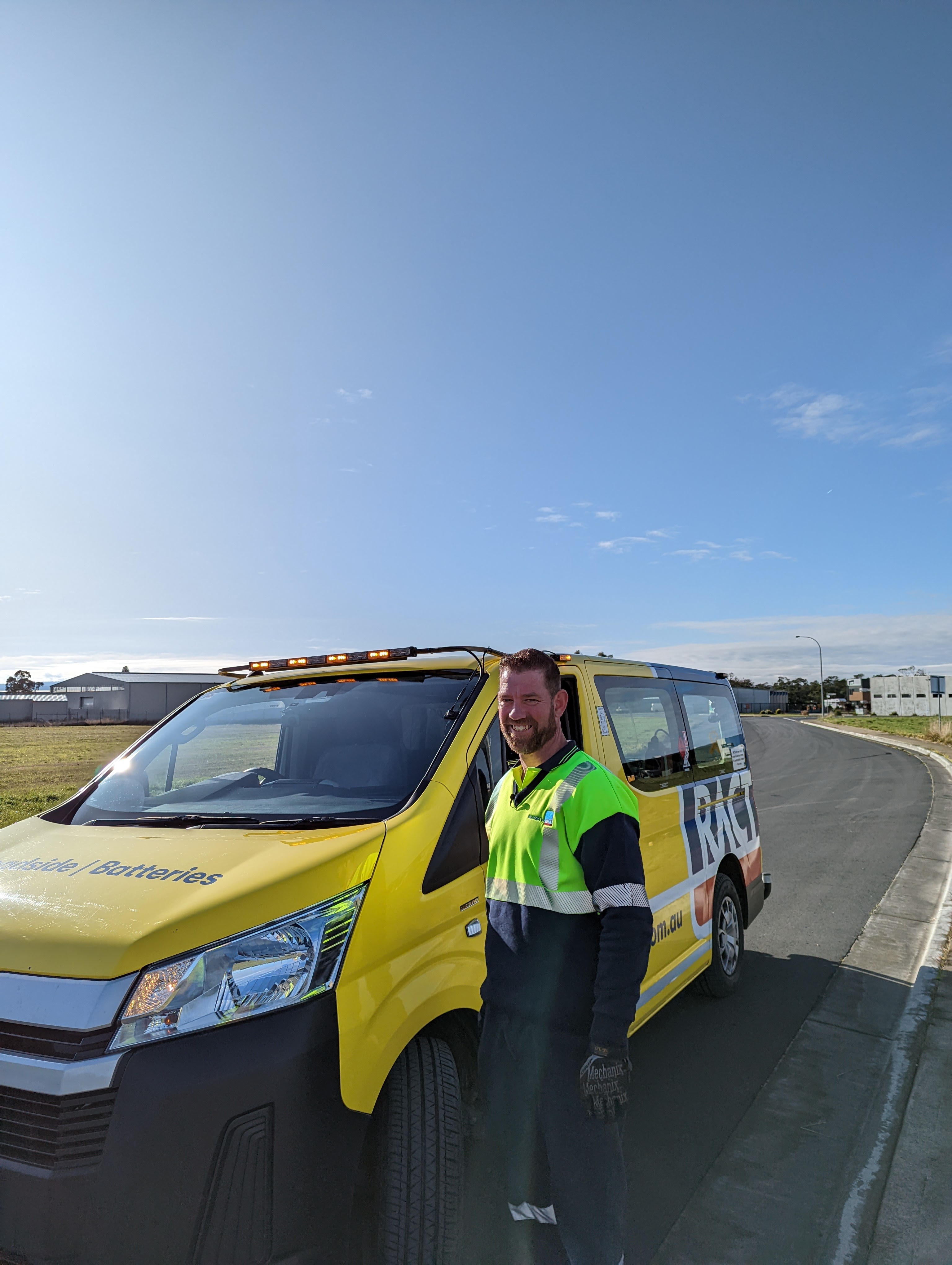 Tim standing beside van on side of road.