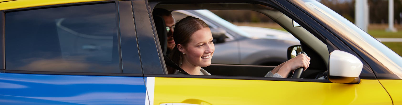 Driving student pulling away from park