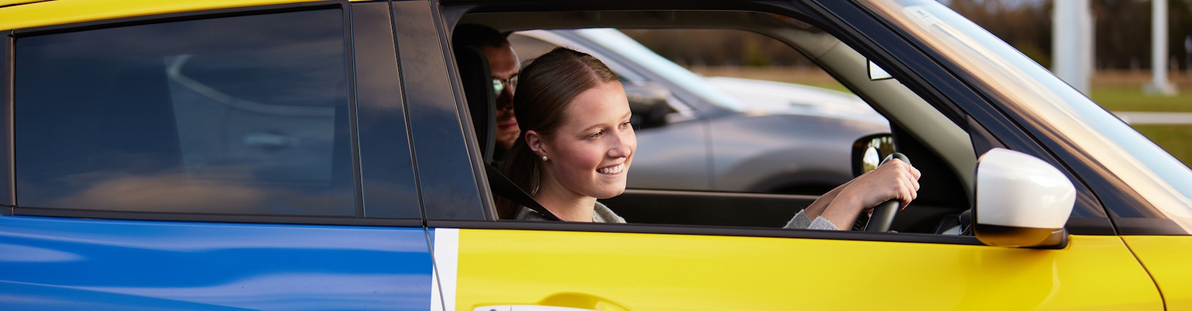 Driving student pulling away from park