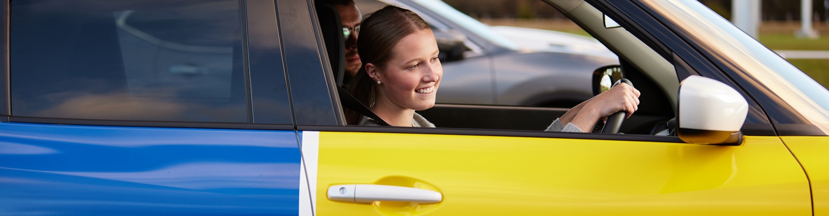 Driving student pulling away from park