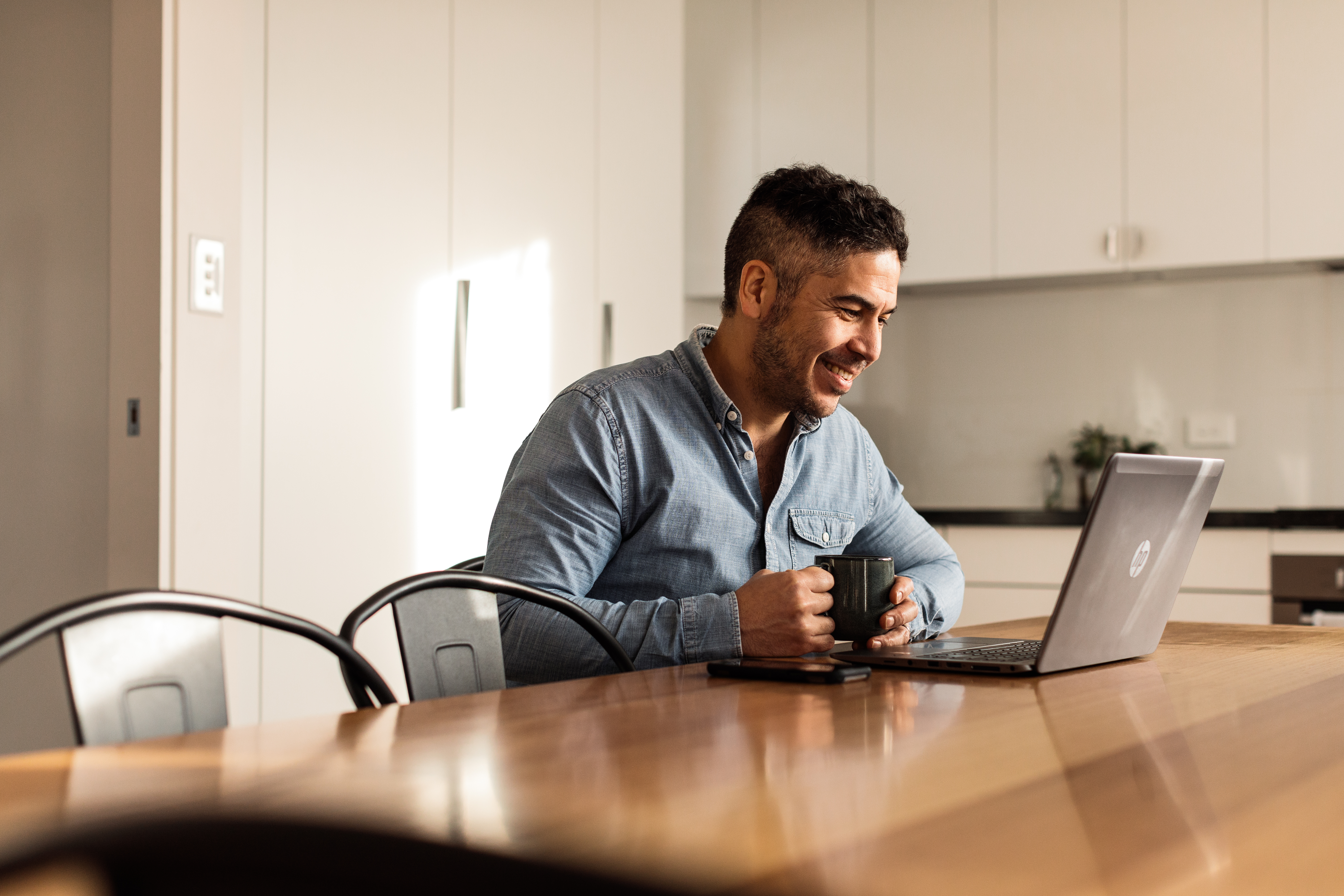 Person working from home at kitchen counter 