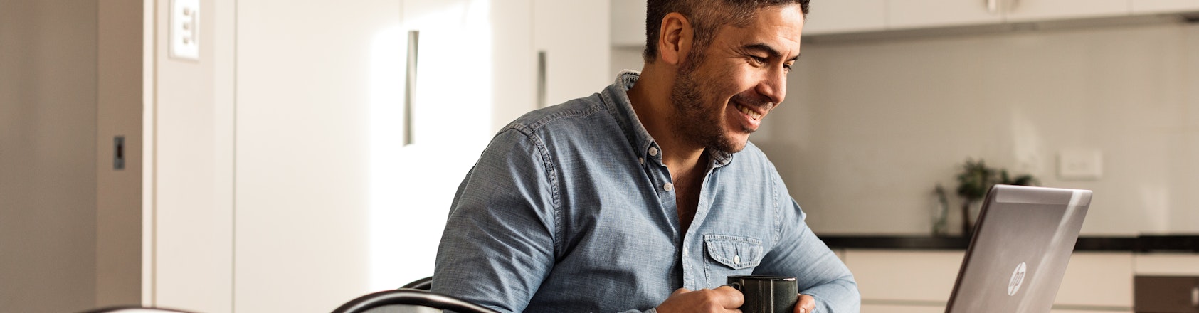 Person working from home at kitchen counter