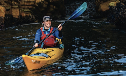 Tory Steward paddling a kayak