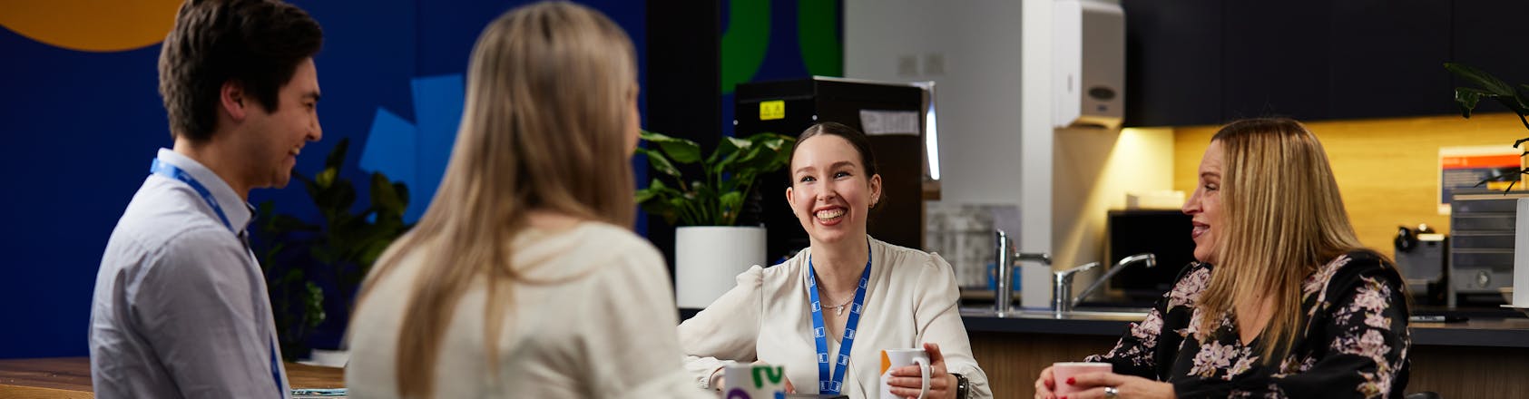 ract staff chatting in break room