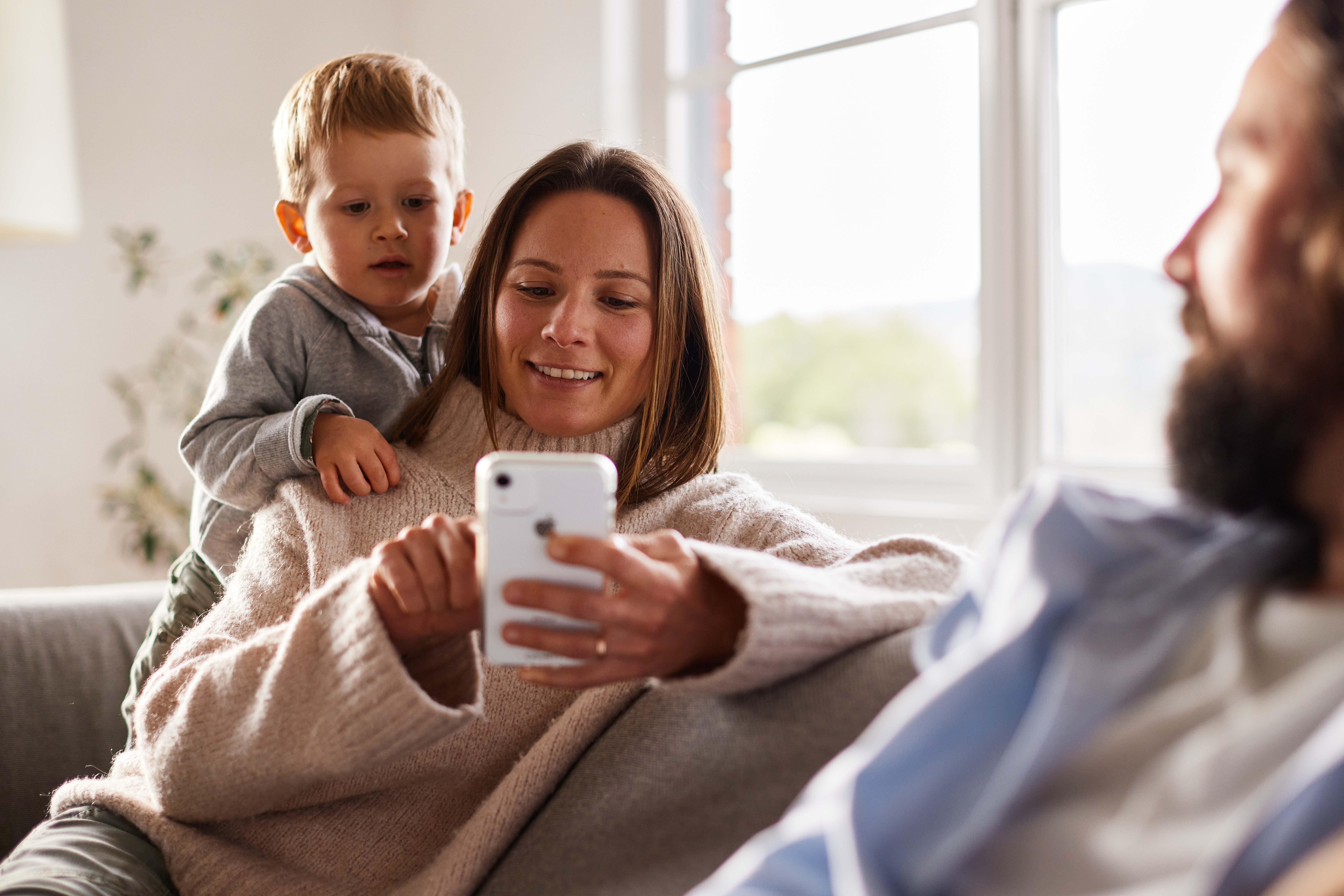 mum on phone child watching