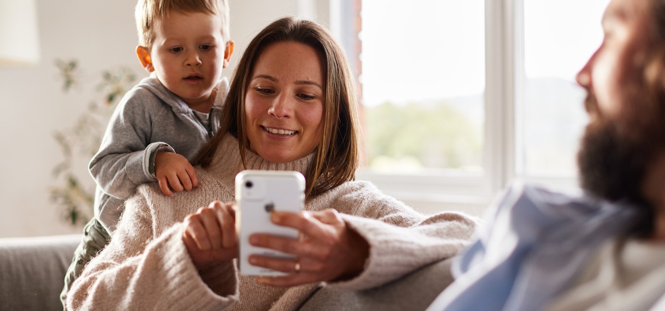 mum on phone child watching