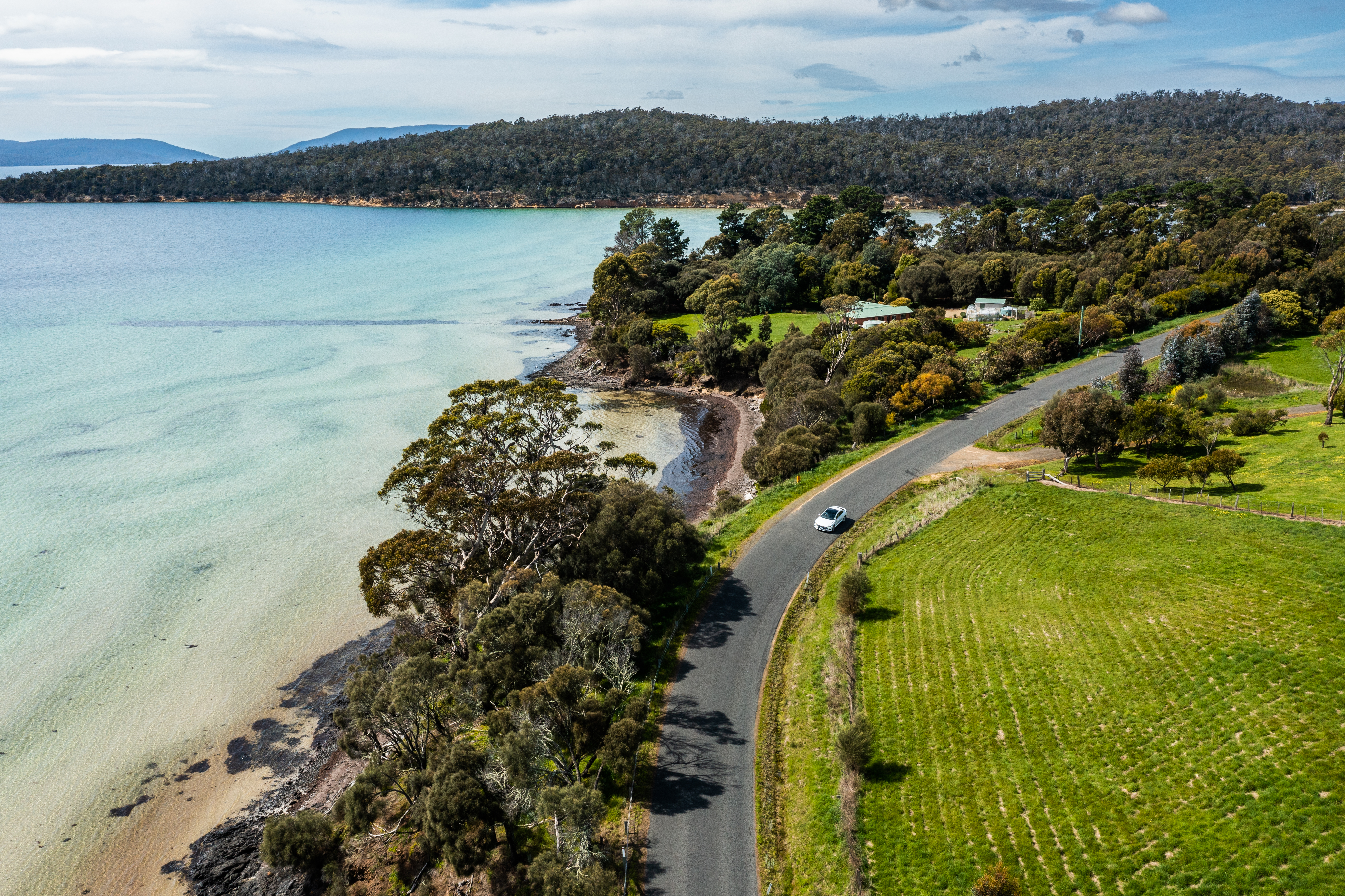 Drone shot of VW Arteon on coastal road