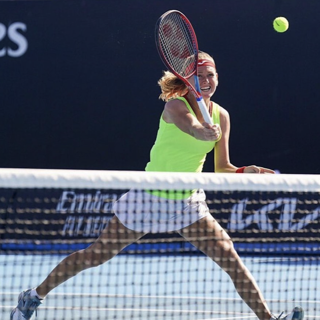 woman volleying in tennis