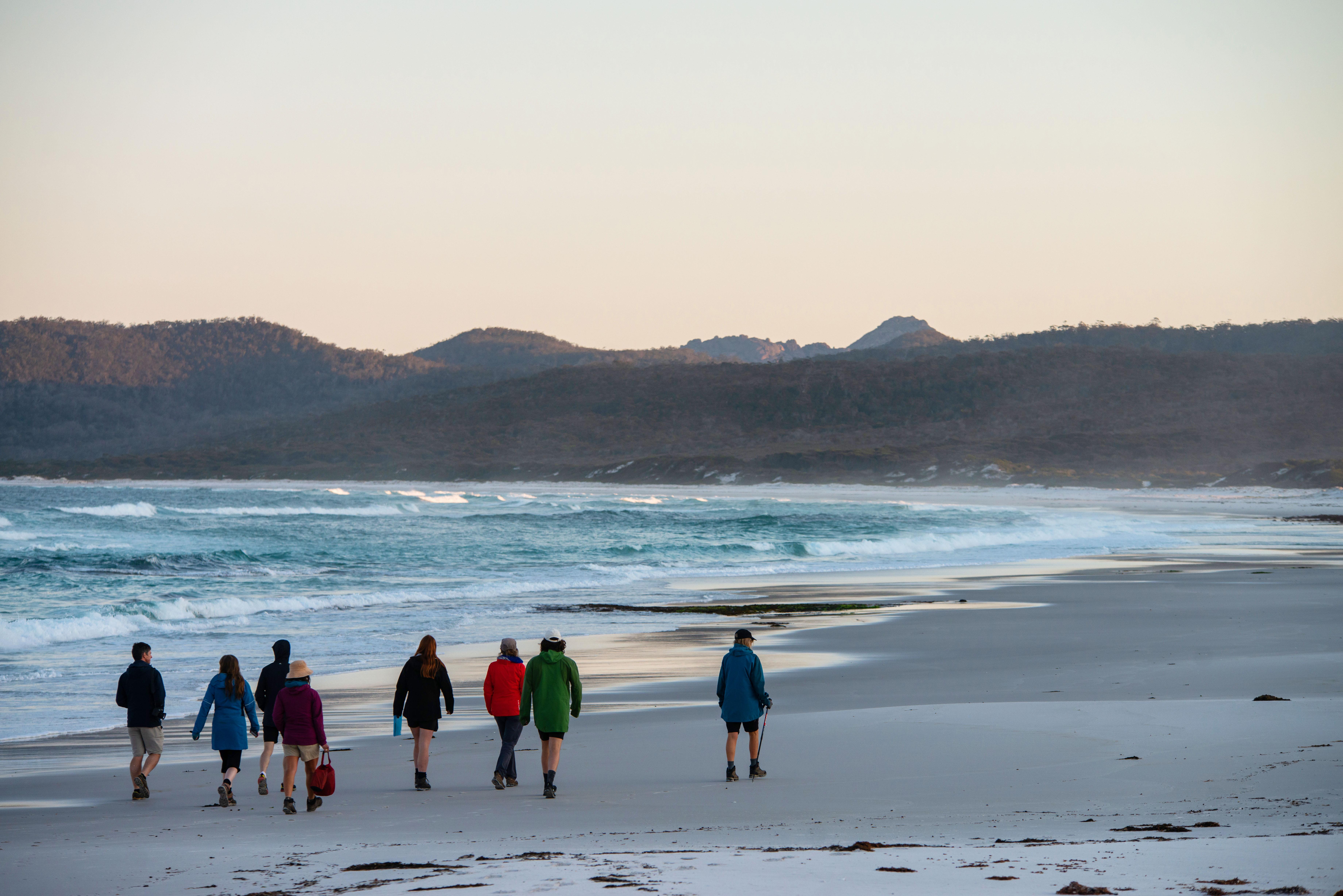 People walking along beach