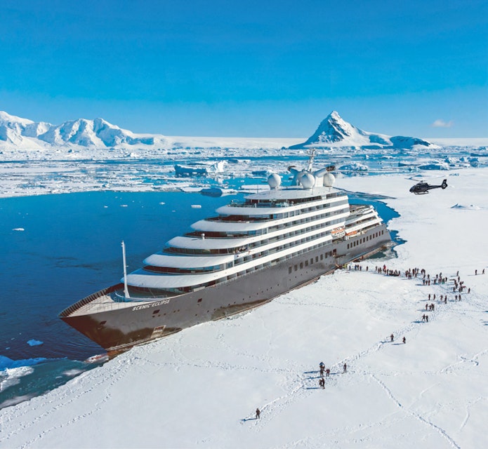 People on the ice boarding the Antarctic cruise ship