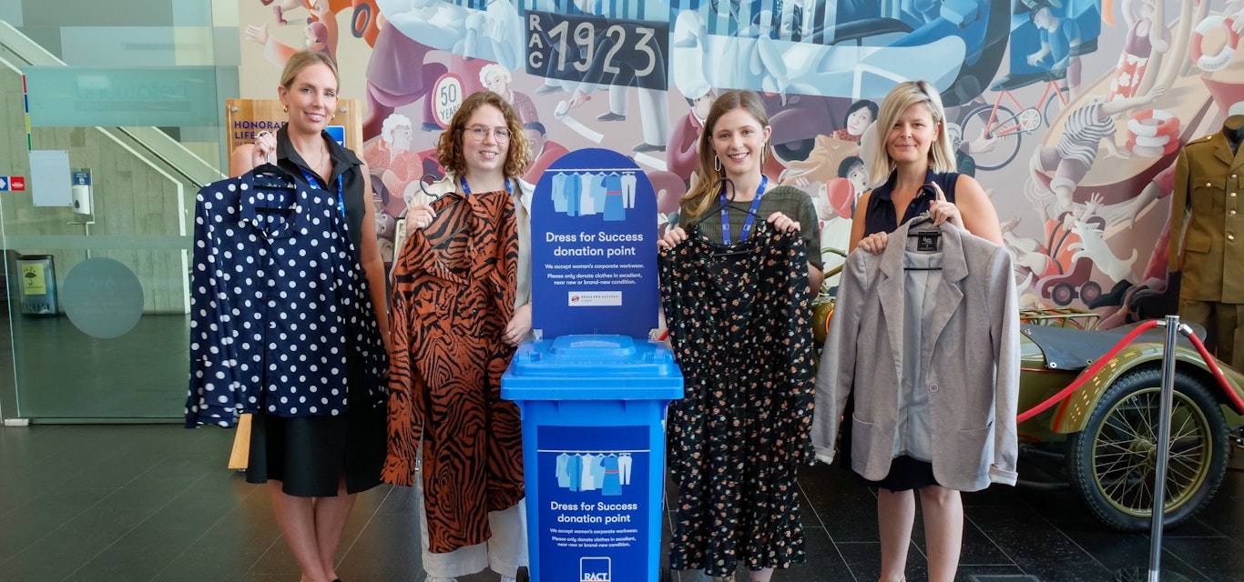 RACT staff members with collection bin and clothing