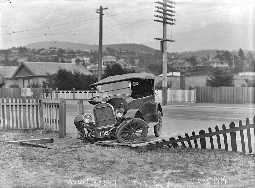 Car crashes into fence circa 1927