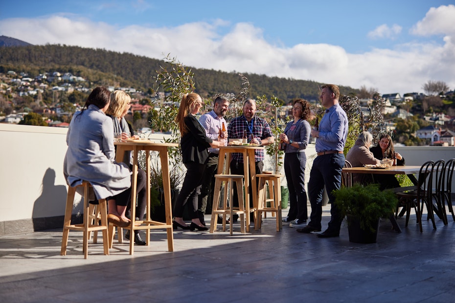 people chatting on RACT House deck