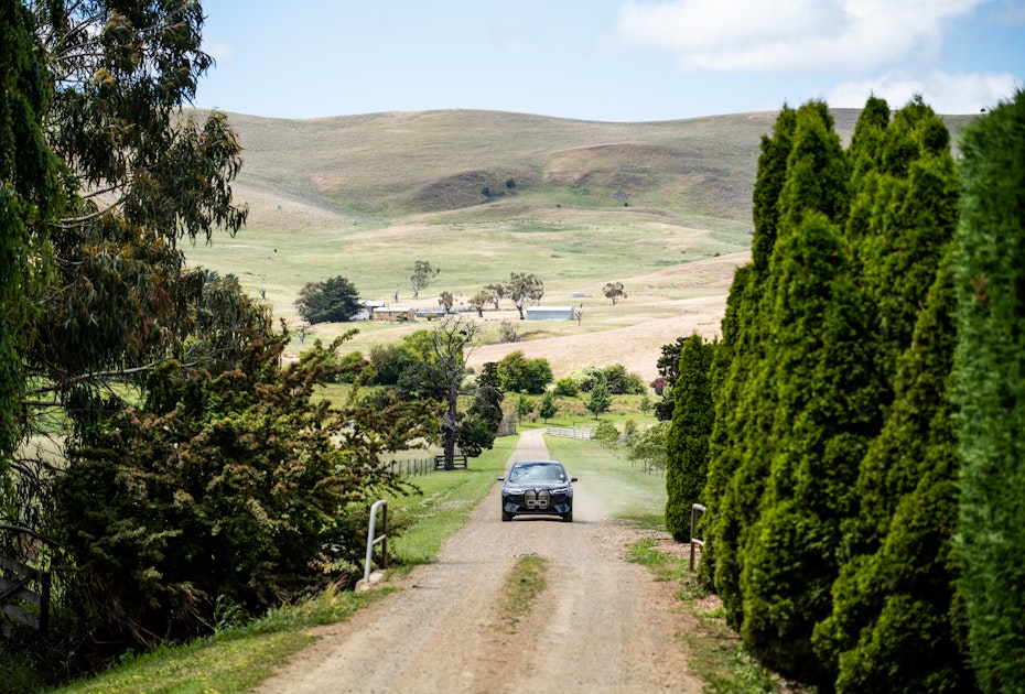 BMW xDrive40 driving up gravel road