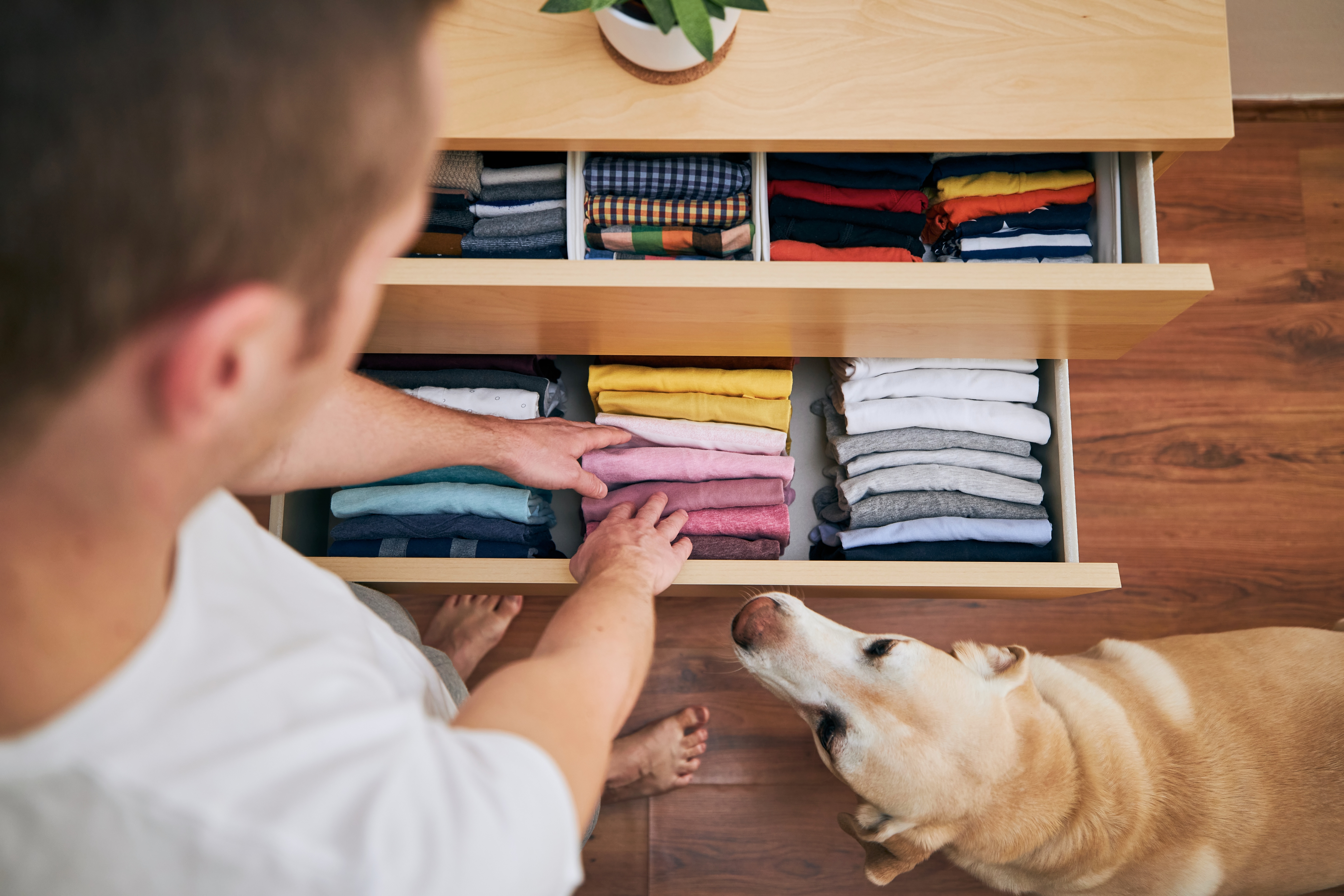 Organising clothes in drawer