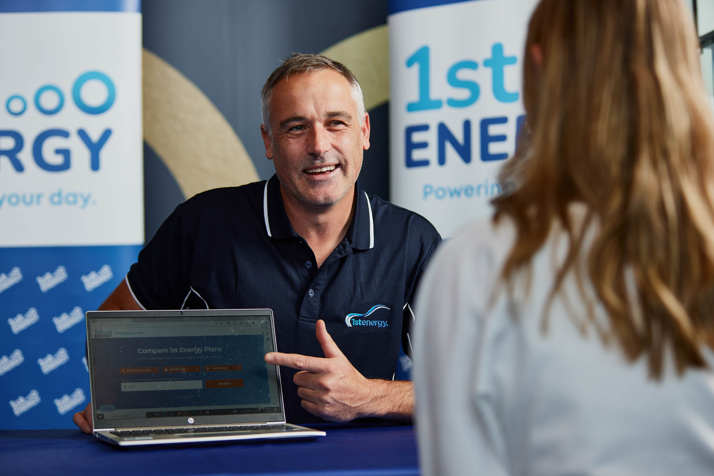 1st Energy rep sitting at table