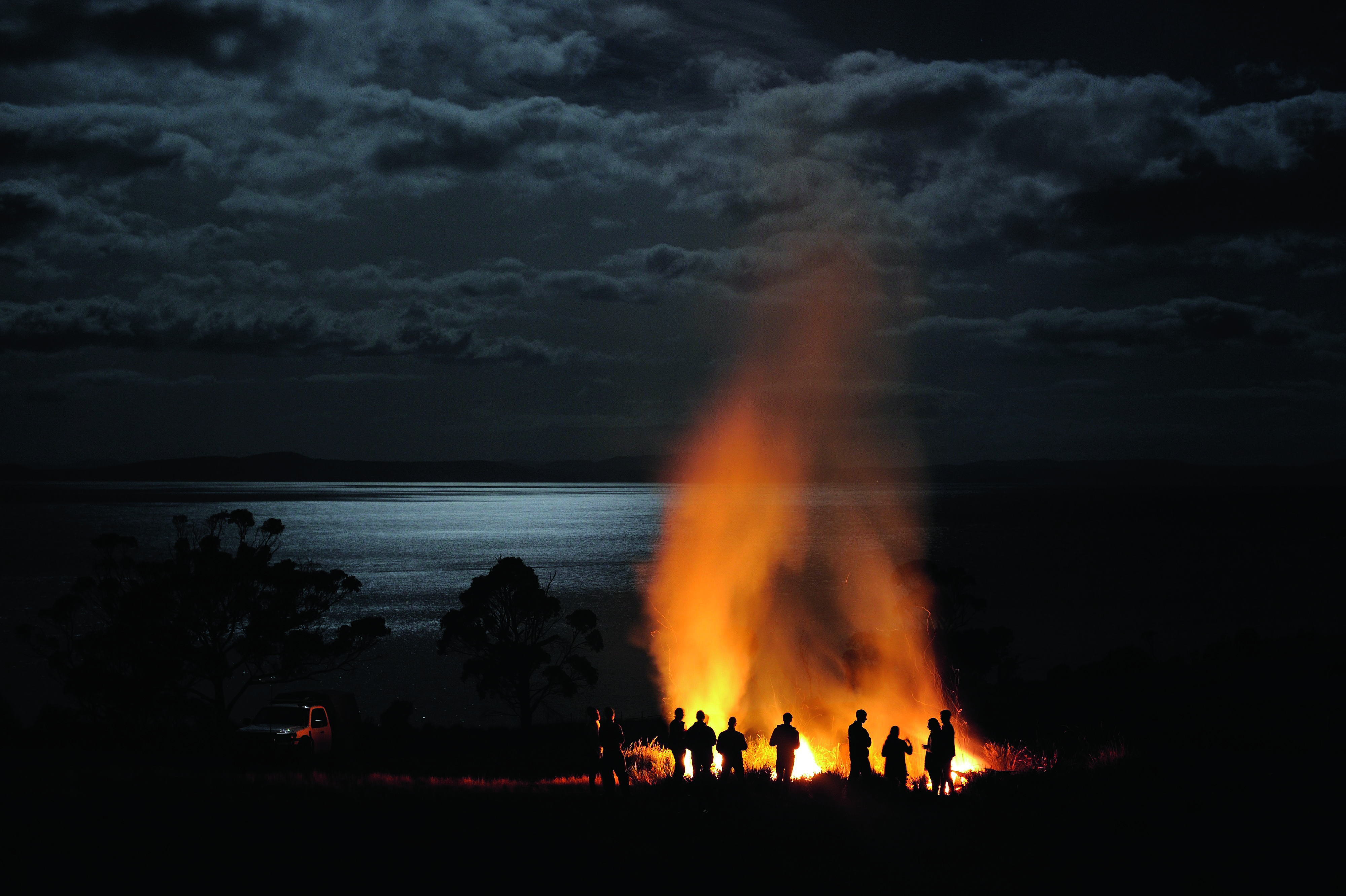 People standing around fire