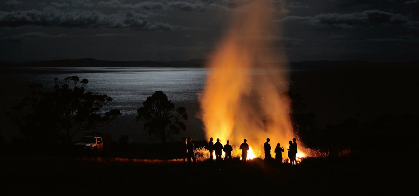 People standing around fire