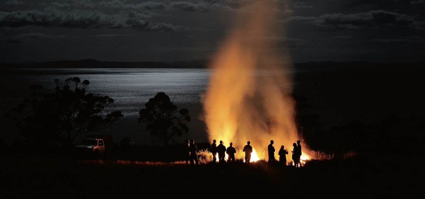 People standing around fire
