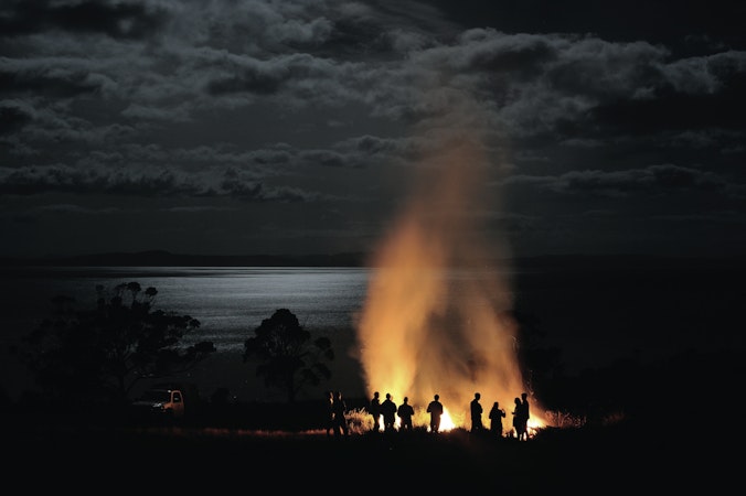People standing around fire
