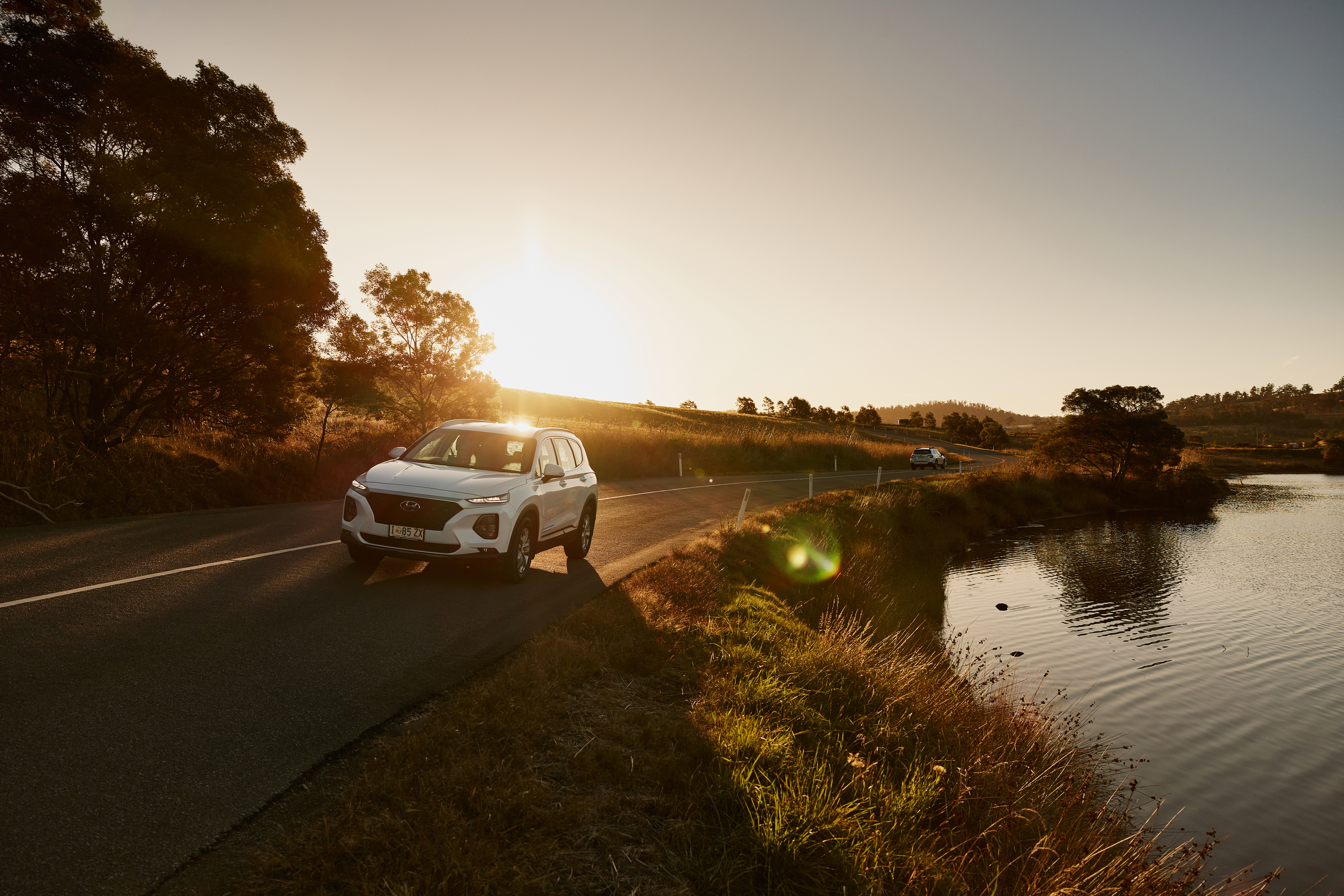 Car driving along scenic tasmanian road
