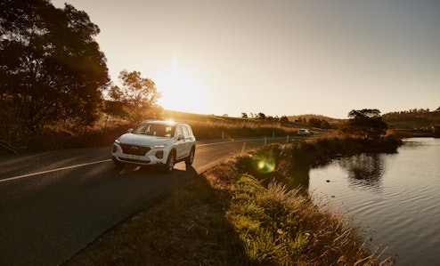 Car driving along scenic tasmanian road