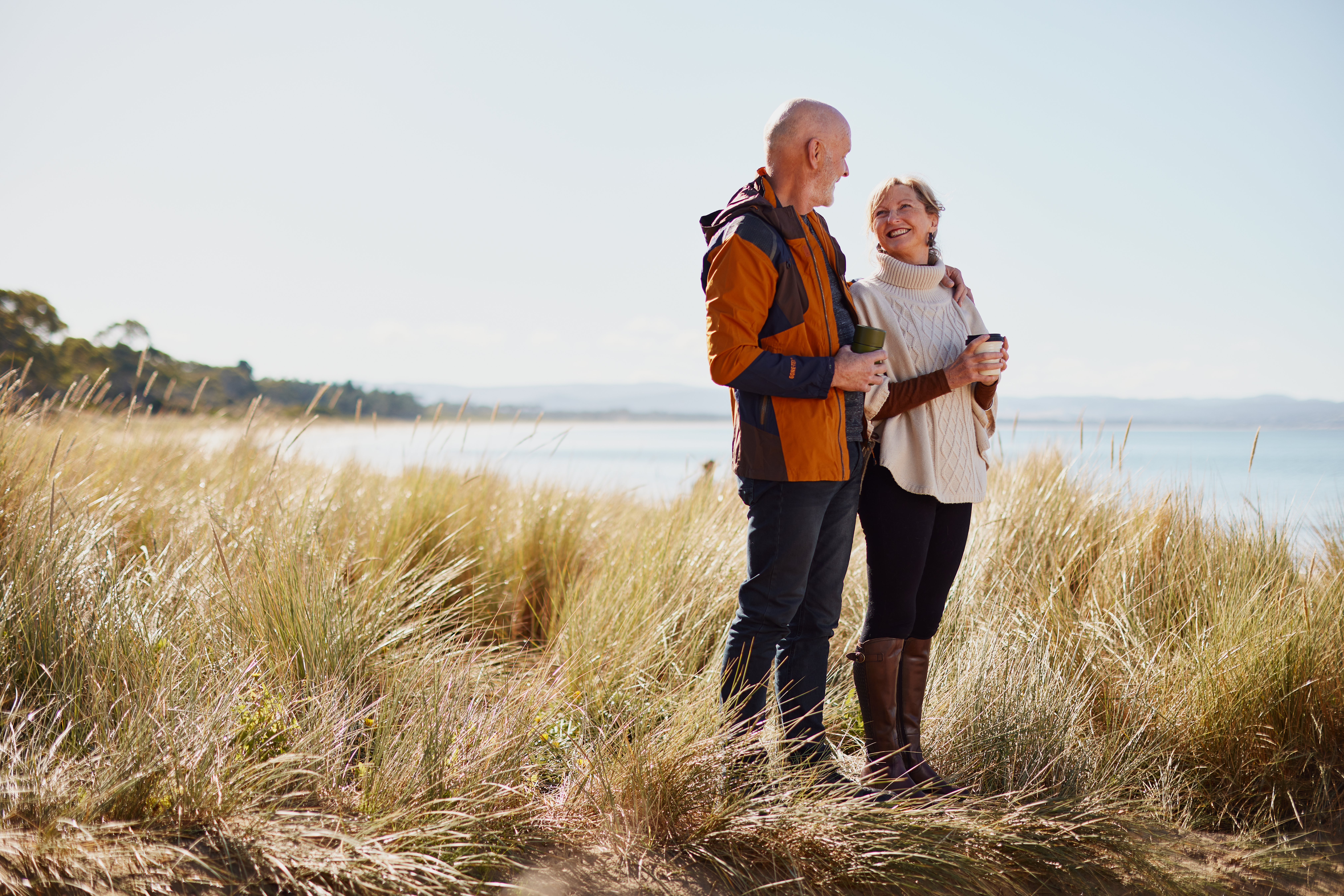 Senior couple standing near the beach