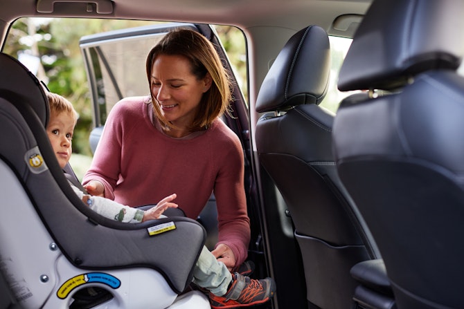 Mum with child in car seat
