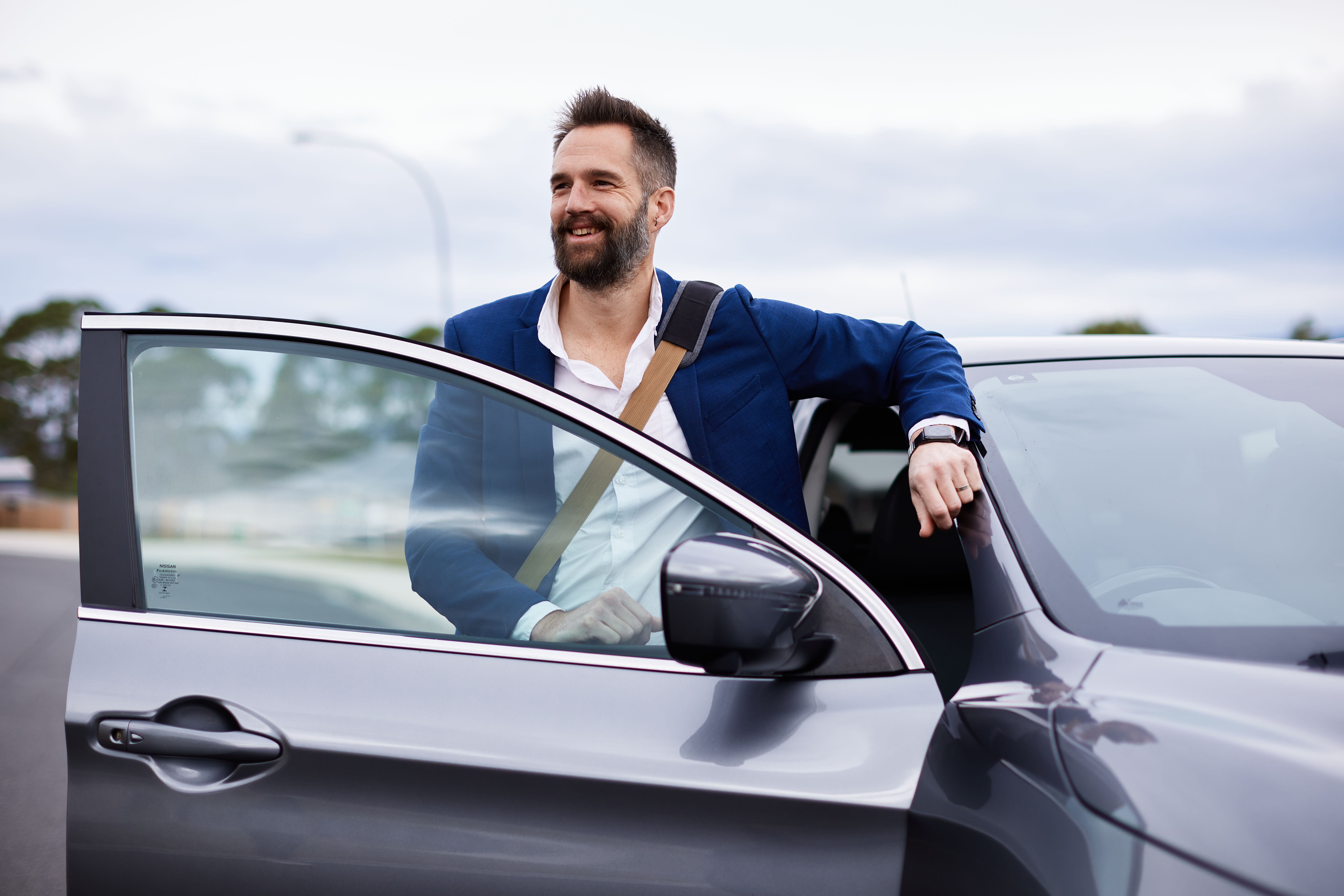 Business man getting into his car