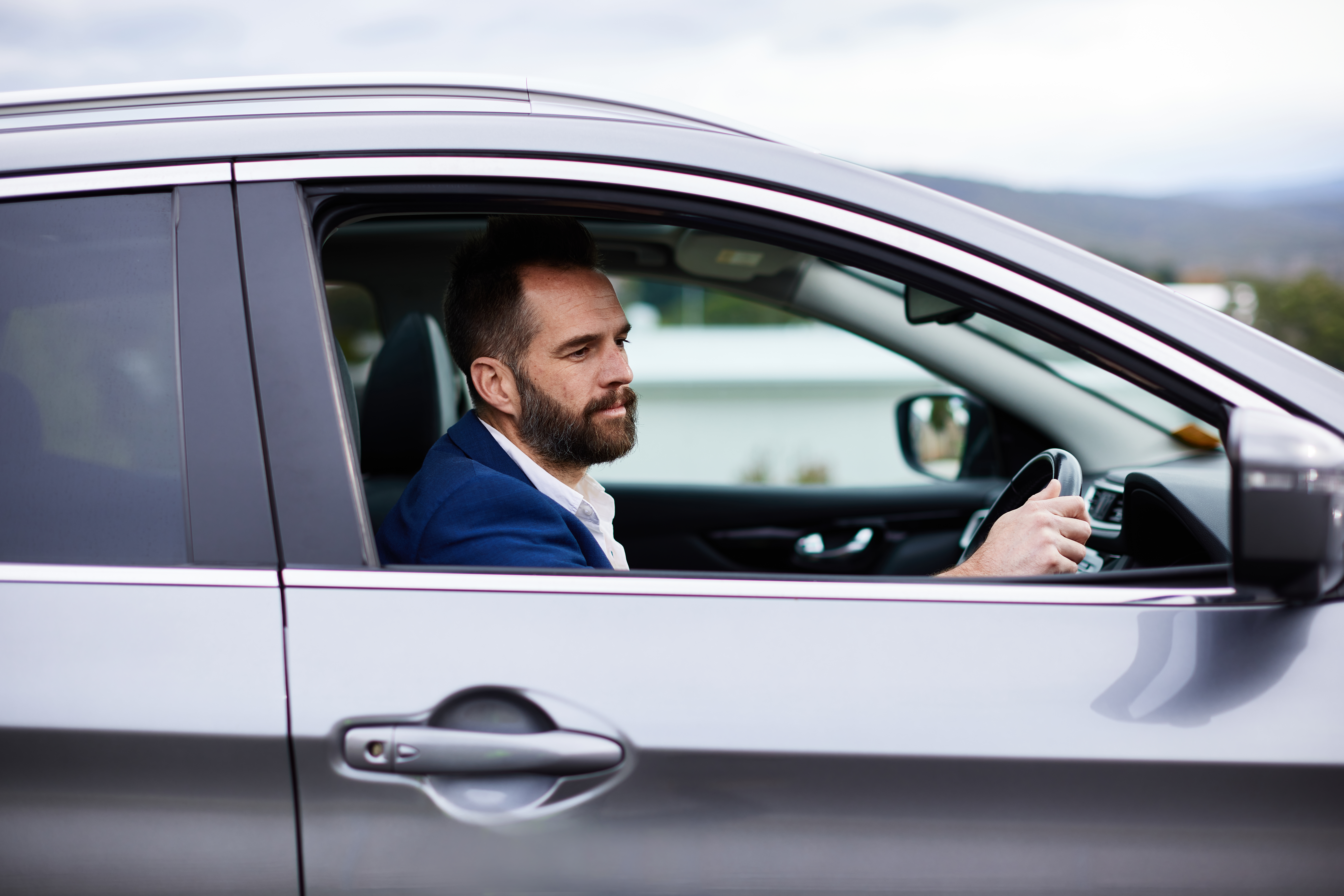 Business man driving his car