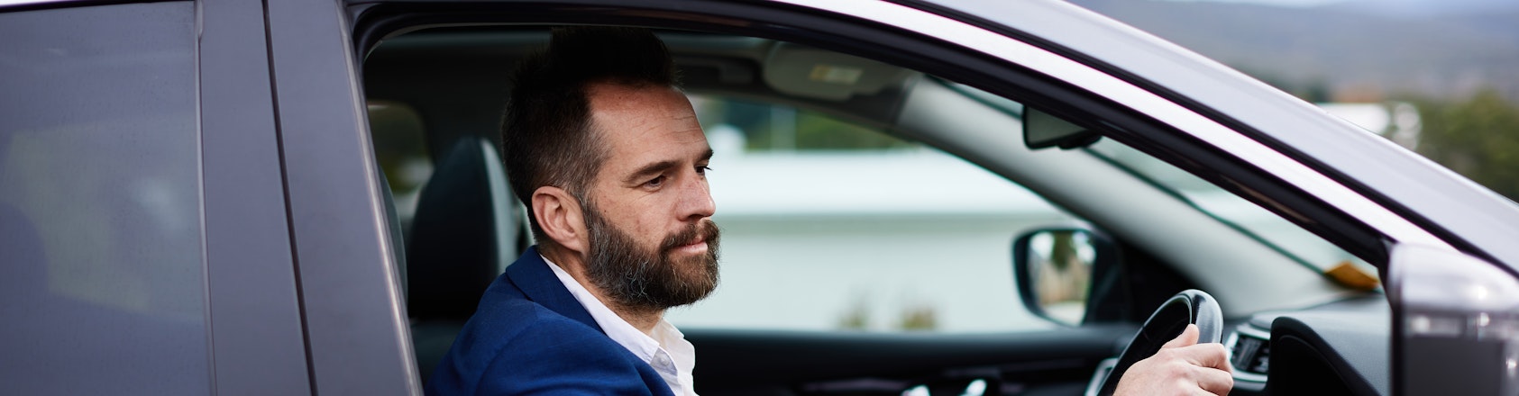 Business man driving his car